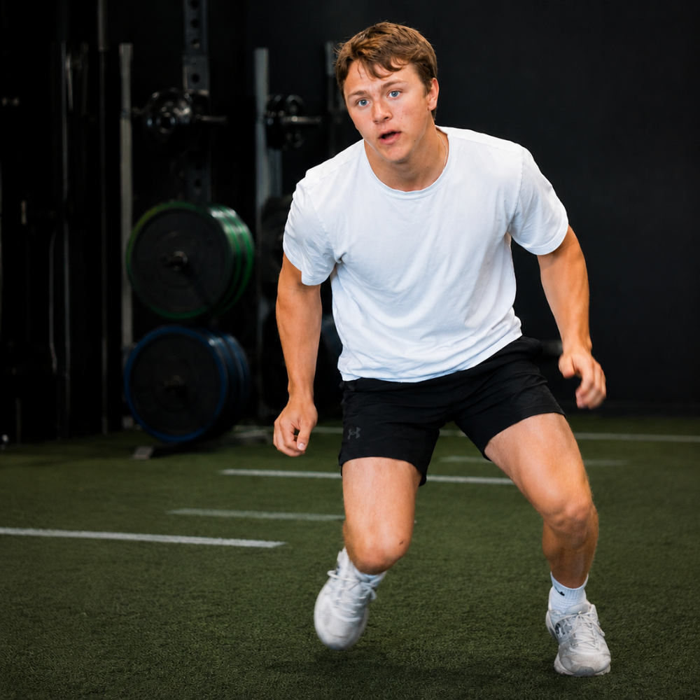 Athlete training individually in a performance gym