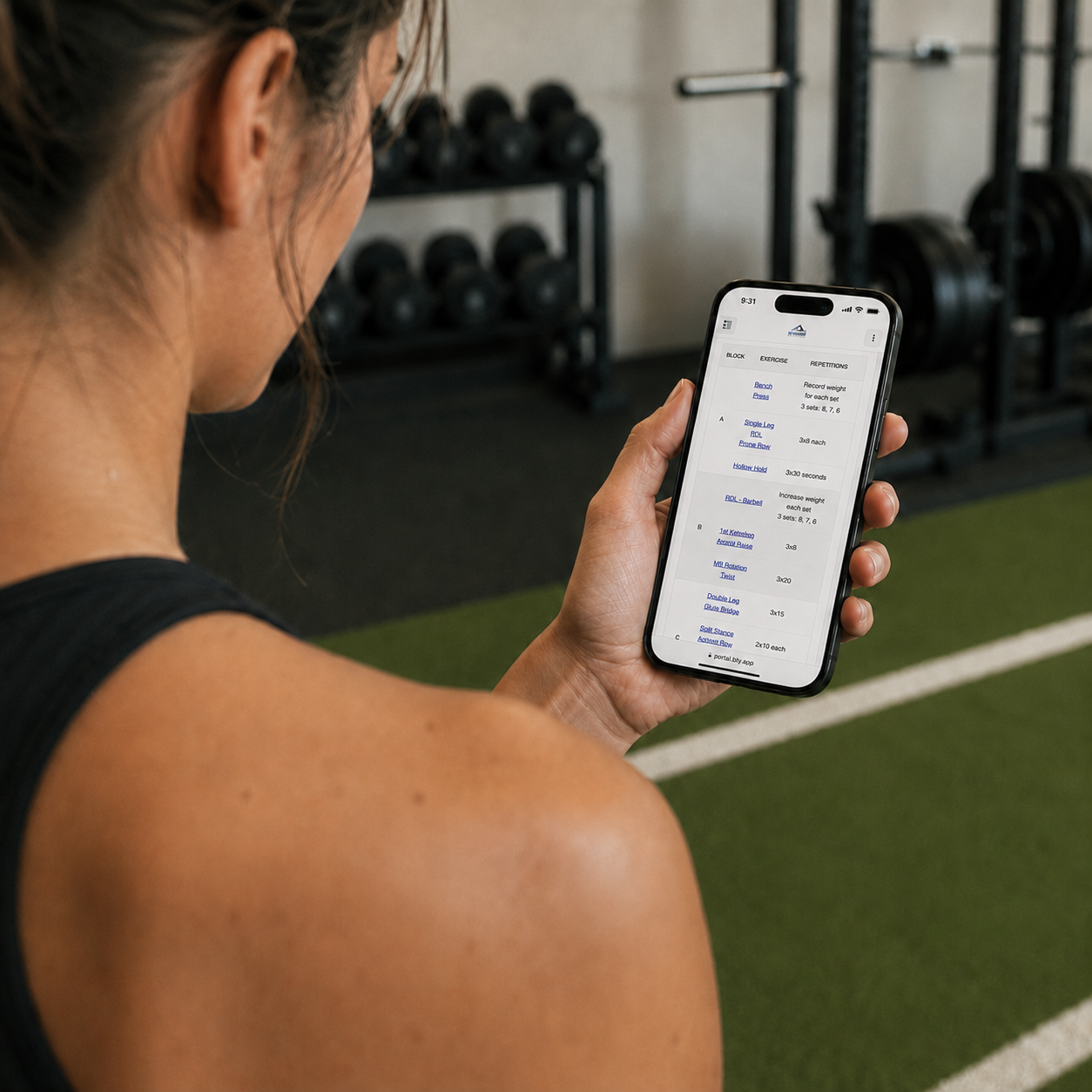 Athlete using Tully on an iPhone in a sports performance facility