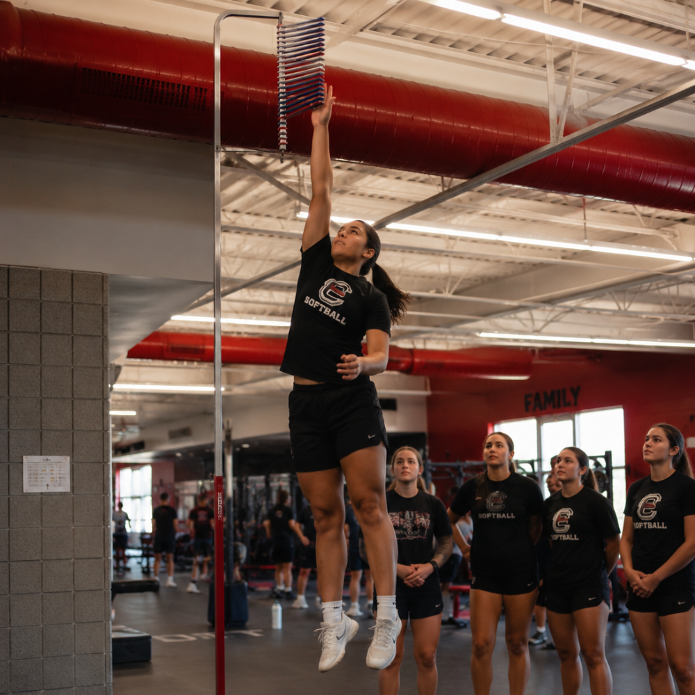 Small group of athletes training together in a performance gym